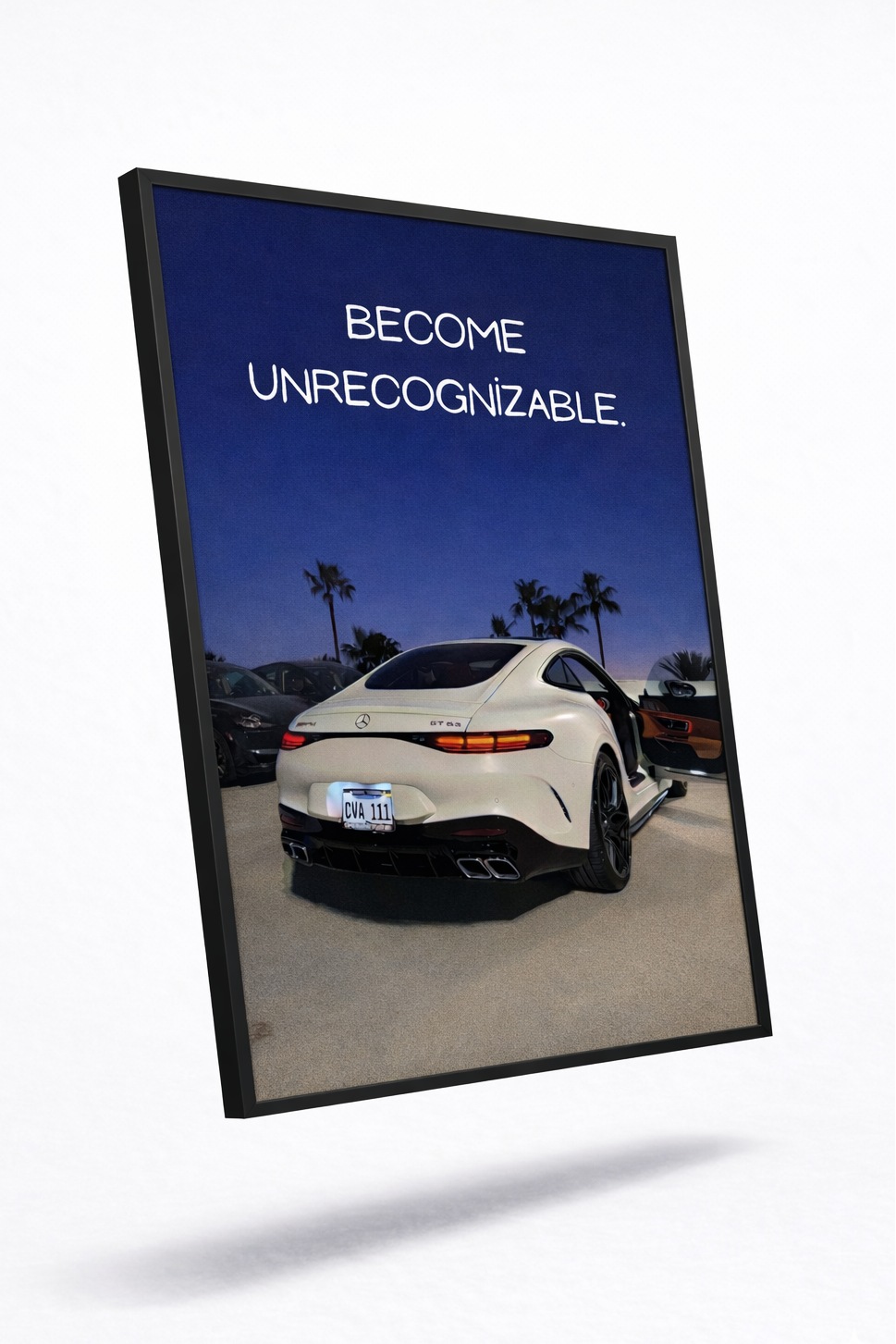Framed poster with a car and text 'BECOME UNRECOGNIZABLE' against a blue sky.
